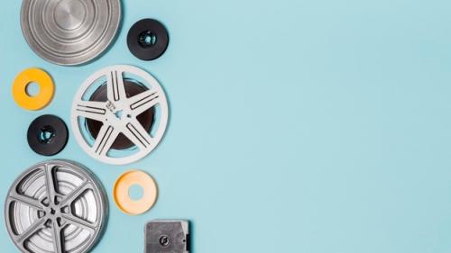 different-type-film-reels-cases-blue-background_23-2148188260-1